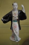 A Japanese porcelain figure.