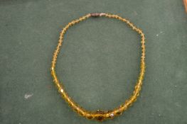 A cut-glass bead necklace.