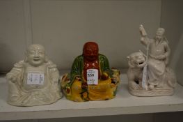 Two Chinese seated Buddhas and another item.
