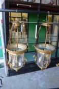 A pair of ornate brass and glass ceiling lights (once glass AF).