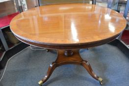 A Georgian style mahogany circular pedestal dining table.