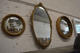 Three decorative gilt framed mirrors.