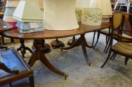 A mahogany twin pedestal dining table.
