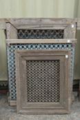 A quantity of Indian hardwood framed wrought iron window grilles.