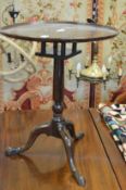 A 19th century mahogany circular tripod table.