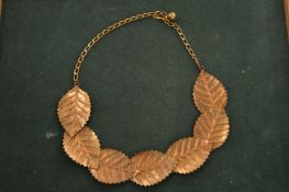 A leaf shaped necklace.