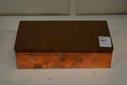 A copper cigarette box.