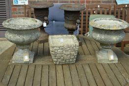 A pair of composite garden urns and a square shaped planter.