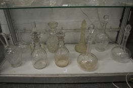 A pair of 19th century cut glass decanters and various other decanters.