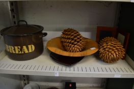 Decorative items to include a pair of very large pine cones.