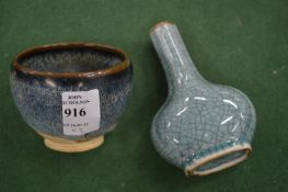 A small Chinese fur glazed tea bowl and a small crackle glazed vase.