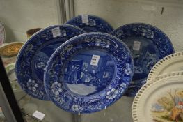 A set of four blue and white plates depicting Doctor Syntax.