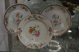 A Chinese Famille Rose plate and a pair of similar plates.