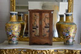 A large pair of decorative Chinese baluster shaped vases, painted with flowers, birds and insects.