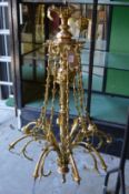 A good ornate brass eight branch chandelier.