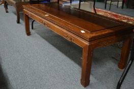 A Chinese hardwood coffee table.