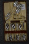 A cased set of six silver coffee spoons, the Apostle coffee spoons and sugar nips.