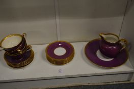 A small group of Spode plum and gilt decorated china.