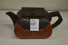 A Chinese two-tone Yixing teapot.