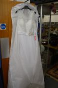 A wedding dress, UK size 16, bust 41 inches, waist 34 inches.