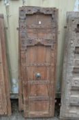 A good large pair of Indian carved hardwood doors with bronze handles.