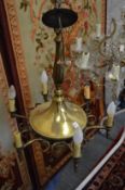 A brass six branch chandelier.