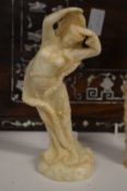An Indian carved soapstone female figure.