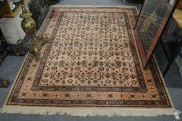 A beige ground Persian style carpet 230cms x 170cms.