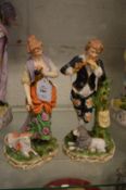 A pair of continental porcelain figure groups.