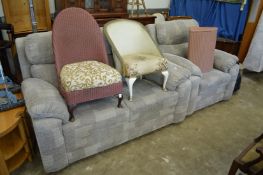 A modern two seater settee and matching armchair.