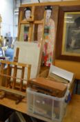 A quantity of artist's materials, two easels and a picture of two Japanese women.