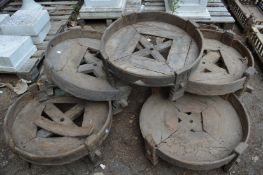 A quantity of Indian large circular wooden stands.