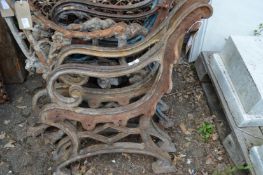 A pair of heavy cast iron bench ends.