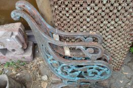 A pair of heavy cast iron bench ends.