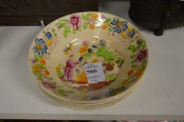 A set of four small porcelain dishes.