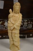 A Chinese carved soapstone figure of a female deity.
