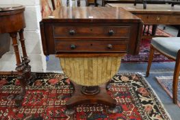 A 19th century mahogany drop-flap two drawer work table.