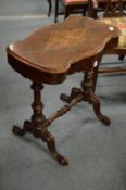 A Victorian inlaid walnut work table (AF).