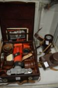 A Leica IIIF camera with fitted case and accessories.