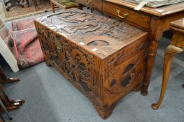 A Chinese carved camphor wood coffer.