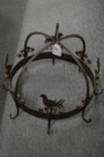 A good wrought iron circular pot hook.