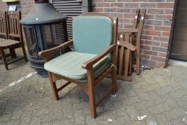 A pair of hardwood garden armchairs (one disassembled).