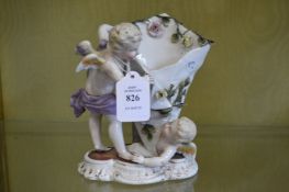 A Dresden figural vase.