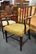 A George III mahogany desk chair.
