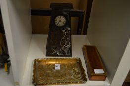 An Art Nouveau embossed brass tray, a similar mantle clock and another item.