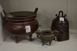 A Chinese bronze censer, a bell and a small censer.