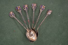 Six silver spoons.