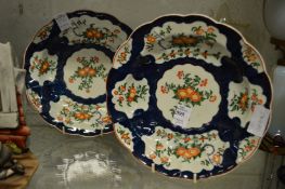 A pair of Chelsea Patch Mark porcelain soup bowls decorated with panels of flowers.