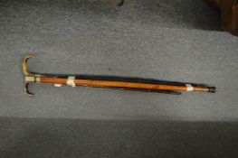 Two walking sticks and an umbrella.
