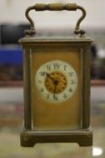 A brass carriage clock.